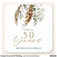 a square coaster with the words, celebrating 50 years and flowers in gold on it