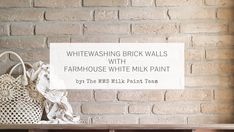 a brick wall with a sign that says, whitewashing brick walls with farmhouse house milk paint