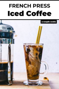 a french press iced coffee next to a cup of coffee