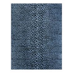 an animal print rug in blue and black