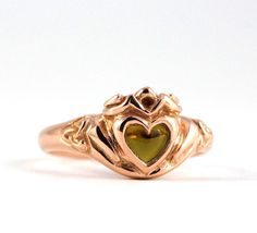 I’m in love with this handmade, hand carved rose gold (or silver), Celtic Claddagh ring with a unique crown, woven love knot band and heart stone. Customizable with your choice of stone and gold or silver. Music Note Ring, Celtic Claddagh Ring, Queen Rings, Alexandrite Stone, Claddagh Ring, Heart Stone, Beautiful Wedding Rings, Claddagh Rings, Emerald Engagement