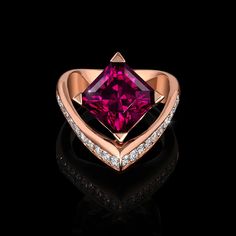 Voila Garnet Ring is poised and passionate. This unique asymmetrically designed ring features a magnificently cut garnet cut by master lapidary Stephen Avery. It is crafted in Adam’s innovative AlbaGold™ and accented by channel set diamonds. Ring Sculpture, Wearable Sculpture, Magic Academy