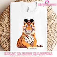 a t - shirt with a cartoon tiger wearing a mouse ears on it's head