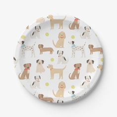 a paper plate with dogs all over it on a white background, showing different colors and sizes