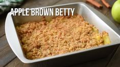 an apple brown betty casserole in a white dish