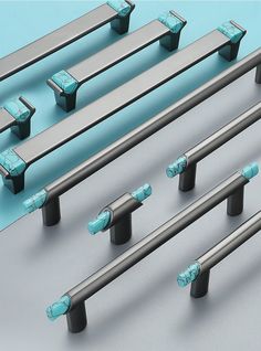 several metal handles and bars on a blue background