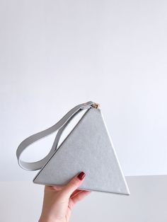 BagForLove-Metallic Pyramid Bag with Wristlet - Women Evening & Clutch Product Description Color Silver Style Glamorous Pattern Type Plain Bag Size Small Quantity 1 piece Magnetic Yes Type Square Bag Composition 100% Polyester Material PU Leather Size Chart INCH CM Size Bag Width Bag Height Bag Length one-size 7.7 6.4 7.7 Size Bag Width Bag Height Bag Length one-size 19.5 16.2 19.5 Similar Products h2 { text-align: center; } .red-box { width: 100%; display: flex; flex-direction: row; flex-wrap: Pyramid Bag, Novelty Bags, Silver Style, Evening Clutch, Square Bag, 7 And 7, Gold Style, Fashion Handbags, Pyramid