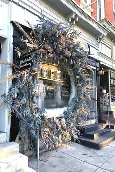 a christmas wreath on the side of a building