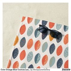 a pair of sunglasses sitting on top of a piece of paper covered in polka dots