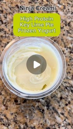 a cup filled with ice cream sitting on top of a counter