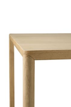 a close up of a wooden table on a white background with no one around it