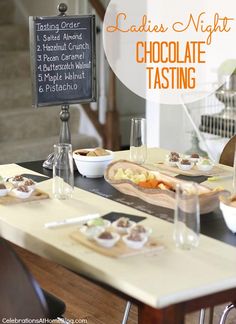 the table is set with plates and bowls of food, along with a sign that says ladies'night chocolate tasting