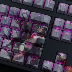 a computer keyboard with an anime character on it's key board and purple keys