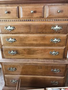 an old dresser with drawers and other items