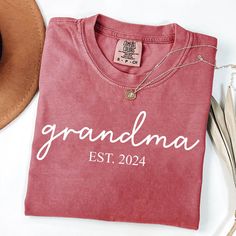 Custom Grandma T-shirts, Comfort Colors Shirts, Est 2024 Shirts, Cool Nana Shirts, Shirts From Daughter, Grandmother Shirts, Grandma Shirts Welcome to our small family business Glamour Apparel.  Your go-to place for all your shirt needs. We as Glamour Team offer ultra-soft shirts made with the highest quality fabrics for you. Our shirts are custom-made prints with the latest technology for long-lasting shirts.  Our Products 👕👚 ✓ Our shirts are handmade in the USA, designed, and shipped from our warehouse in Texas. ✓ Our shirts are durable, extremely soft, stylish, vibrant colored shirts made in an eco-friendly process. ✓ We use various t-shirt brands and Gildan Sweatshirts. You can select Comfort Colors Shirts to reach unique and adorable Comfort Colors Shirts or you can select our high Mother's Day Crew Neck Cotton Shirt, Mother's Day Cotton Crew Neck Shirt, Family Matching Red Tops With Letter Print, Red Name Print Top For Summer, Red Tops With Name Print For Summer, Family Matching Crew Neck Cotton Tops, Red Short Sleeve T-shirt With Name Print, Relaxed Fit Crew Neck T-shirt With Name Print, Red Crew Neck T-shirt With Name Print