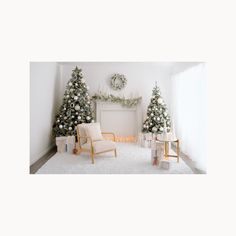 a living room decorated for christmas with white furniture and trees on the wall behind it