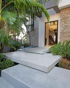 two concrete steps in front of a house