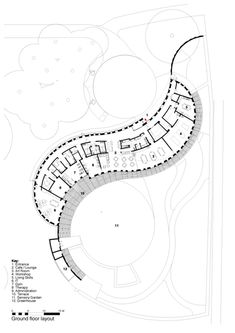 the site plan for an apartment complex with circular walkways and parking spaces on each side