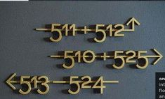 the numbers are made out of wood and have arrows pointing in different directions on them