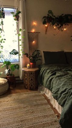 a bedroom with plants and lights on the wall