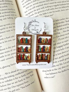 Book Earrings| Bookshelf Earrings| Reader Gifts| Book Earring Dangle| Book Club Gifts| Librarian Gift by thehouseofmarigolds on Etsy https://www.etsy.com/listing/1415975635/book-earrings-bookshelf-earrings-reader Bookshelf Earrings, Book Club Gifts, Reader Gifts, Ears Pierced, Gifts Book, Weird Jewelry, Book Earrings, Bookclub Gifts, Geometric Type