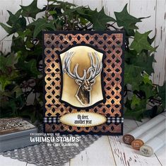 a card with an image of a deer on it and some other items next to it