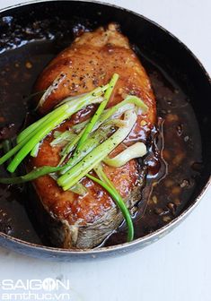 a close up of a meat in a pan on a table