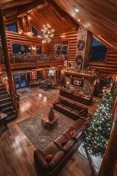 a living room filled with furniture and a christmas tree in the middle of the room