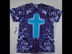 a blue tie dye shirt with a cross on it