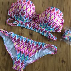 Nwot Victoria’s Secret The Midi Beach Bandeau Bikini. Push-Up Padding, Underwire, Side Boning For Support, Back Hook Closure, And Removable Halter Straps. The Bottoms Are The Strappy Cheeky With Side Straps In A Size Medium. Color:Ikat 8pc Size: 36c Sister Size Down: 34d Sister Size Up: 38b Pink Underwire Tankini For Summer, Pink Bandeau Tankini For Swimming, Strapless Pink Tankini For Summer, Beachwear Multicolor Bandeau Swimwear, Bohemian Bandeau Swimwear For Summer, Multicolor Strapless Swimwear For Poolside, Pink Bandeau Tankini For Poolside, Pink Underwire Tankini For Pool, Summer Bandeau Tankini In Pink