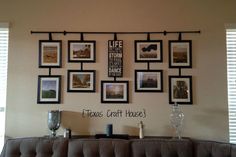 a wall with many pictures hanging on it