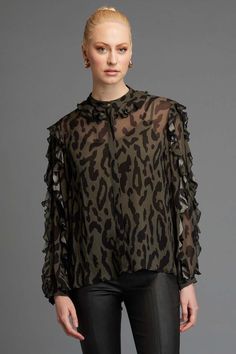 The Fate + Becker Dreaming Top in Khaki animal print is full of surprises. It features a Mandarin style collar with frill edge that adds a touch of elegance to this blouse. The long sleeves with frill detail add a haute couture element and as an added bonus, there is a concealed placket with gold top button. This blouse also has a black lining for added comfort and privacy. This blouse is not only stunning in design but also incredibly versatile. The Khaki animal print is a bold statement that can be dressed up with a sleek pair of black trousers for a night out or paired with your favorite jeans for a more casual look. The loose fit of the blouse makes it comfortable and flattering for any body type, while the luxurious fabric drapes effortlessly over your curves. The Fate + Becker Dreami Long Sleeve Summer Dress, Haute Couture Looks, Maxi Dress Winter, Couture Looks, Frill Tops, Linen Loungewear, Frill Sleeves, Sleeveless Dress Summer, Gold Top