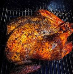 a roasting turkey is on the grill