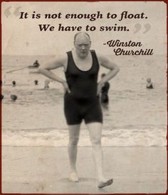 an old photo of a man standing on the beach with his hands on his hips