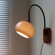 a lamp that is on the side of a wall