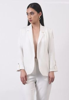 Introducing our exquisite white blazer, meticulously hand-embellished with gold and silver sequins in a stunning floral motif. Crafted from luxurious banana crepe fabric, this blazer exudes elegance and sophistication. Our white blazer with hand-embellished gold and silver sequins is a true masterpiece. The intricate floral motif adds a touch of femininity and grace, making it a perfect choice for any special occasion or formal event. Chic Long Sleeve Blazer For Weddings, Spring Wedding Suits With Long Sleeves, Spring Wedding Long Sleeve Suits, Elegant Spring Blazer With Hidden Button Closure, Elegant Lapel Collar Blazer For Spring, Elegant Spring Blazer With Lapel Collar, Elegant Spring Blazer For Workwear, Elegant Spring Blazer For Work, Chic Single-breasted Wedding Blazer