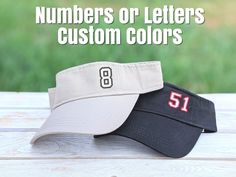 Distinct Headwear Presents... Custom Embroidered Number or Letter Visor Your choice of visor color and thread colors. Limit of 1, 2 or 3 letters or numbers placed in one corner. If you need more or something changed, please contact us first. Photos Show: Photo 1 - Black visor with white main color and red outline; khaki visor with white main color and black outline. Photo 2: Black visor with white main color and red outline; white visor with black main color and white outline. All embroidery is Embroidered Number, Red Outline, Embroidered Gifts, Cap Designs, Visor Hat, Thread Colors, Visor Hats, Hat Cap, Photo 1