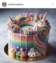 there is a cake decorated with rainbows and unicorns on it's side