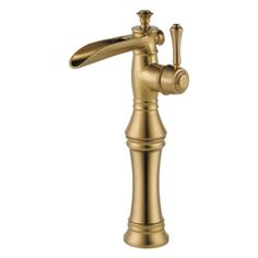 an antique brass faucet on a white background