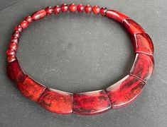 Fabulous vintage statement collar necklace with enormous panels of beautifully shaped cherry red coloured Bakelite. This is a lovely unusual piece with valuable beads - different from the more standard chunky oval beads, which I love. The piece weighs a total of 81 grams. The pictures show the beautiful colouring of the Bakelite pieces. The cherry reddish colour translucent beads have some beautiful marbling patterns within each. The red colour makes a simichrome test for Bakelite a little diffe Vintage Spider, Cherry Red Color, Statement Collar, Vintage Cherry, Statement Collar Necklace, Oval Beads, Vintage Bakelite, Fringe Necklace, Red Colour