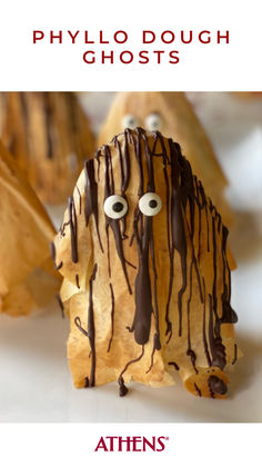 a close up of food on a plate with chocolate drizzled over it