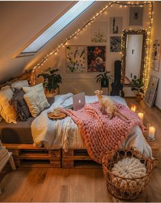 a cat is laying on top of a bed in a room with lots of lights