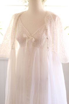 V-neck Lace Trim Nightgown For Wedding, Floor-length White Nightgown For Wedding Night, White Floor-length Nightgown For Wedding Night, Lace Gown With Sheer Bodice For Wedding Night, White Lace Nightgown For Wedding, V-neck Wedding Nightgown With Delicate Lace, Wedding Nightgown With Lace Bodice, White Lace Wedding Nightgown, Floor-length Lace Trim Nightgown For Wedding