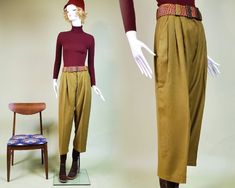 "Vintage mod 1960's slacks. No brand or fabric tags. THE SKINNY Brownish olive wool trousers. High rise& wide leg with a slight taper & crop. Front pockets & plain back. Pleated front. Waist has wide belt loops. Zip fly & button closure. Button is ornamental plastic. Pre-creased. MEASUREMENTS (laying flat) Waist: 13 1/2\" Front rise: 13 1/2\" Back rise: 17\" Hips: 23 1/2\" Inseam: 25 1/2\" Leg opening: 10\" Great vintage condition. No stains or rips." Brown Vintage Pants For Winter, Vintage Brown Winter Pants, Vintage Brown Pants For Fall, Vintage Khaki Bottoms For Fall, Vintage Wool Pants For Fall, Fitted Vintage Wool Pants, Vintage Green Pants For Fall, Retro Wool Bottoms For Fall, Retro Style Winter Workwear Pants