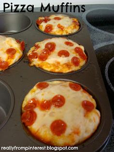 four mini pizzas in a muffin tin on the stove