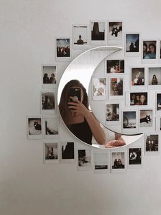 a woman taking a selfie with her cell phone in front of a crescent shaped mirror