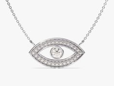 Embrace protection and modern elegance with this 14k solid gold necklace. A single, ethically sourced diamond twinkles at the center of the evil eye symbol, offering a touch of sparkle and warding off negativity. Choose from classic yellow, white, or rose gold for a personalized touch. The bezel setting adds a contemporary twist, making this a perfect everyday talisman. FEATURES• Made to Order• Gold Kt: 14k Solid Gold, 18k Solid Gold• Gold Color: Rose Gold, Yellow Gold, White Gold• Available Len White Gold Diamond Necklace With Si Clarity, Anniversary White Gold Necklaces With Diamond Eyes, Anniversary White Gold Necklace With Diamond Eyes, Elegant Cubic Zirconia Evil Eye Necklaces, Elegant Cubic Zirconia Evil Eye Necklace, Elegant Evil Eye Necklace With Cubic Zirconia, White Gold Diamond Necklace With Diamond Eyes For Anniversary, Modern White Gold Jewelry With Diamond Eyes, Luxury Sterling Silver Necklace With Diamond Eyes