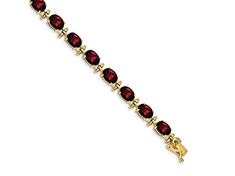 14k yellow gold 16 cttw garnet bracelet. Measures approximately 3/16 of an inch in width and has a box catch closure. Classic Gold Ruby Tennis Bracelet, Elegant Red Gold Bracelet For Formal Occasions, 14k Gold Bracelet With Birthstone For Formal Occasions, Elegant Red Bracelet With Birthstone, Formal 14k Gold Bracelet With Birthstone, Formal Garnet Gemstone Bracelets, Elegant Red Birthstone Bracelet, Faceted Garnet Jewelry In Yellow Gold, Elegant Garnet Bracelets For Formal Occasions