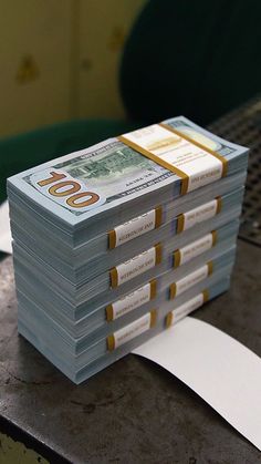 stacks of money sitting on top of a table