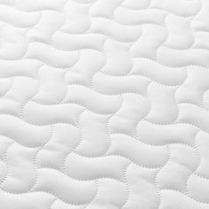 close up view of the white quilted mattress